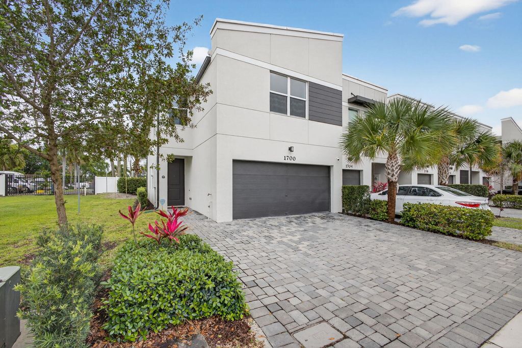 Photo of 1700 Lindley Street, Mangonia Park, FL 33407 (MLS # B26017357)