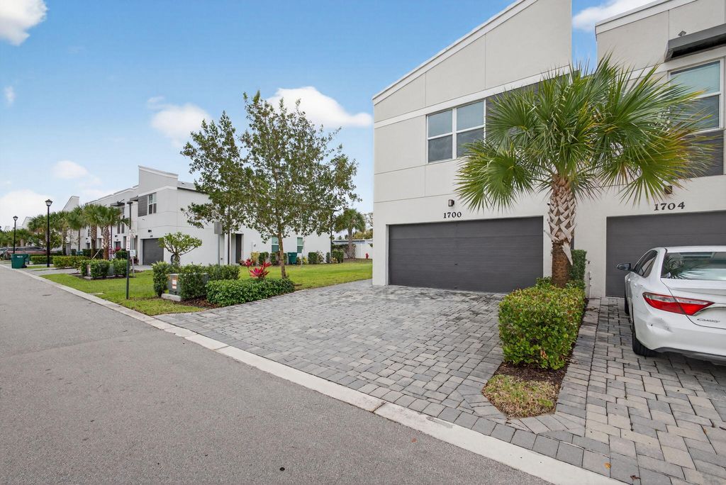 Photo of 1700 Lindley Street, Mangonia Park, FL 33407 (MLS # B26017357)