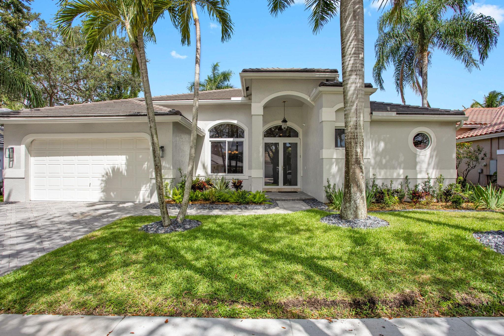 Discover the allure of gated living in Weston Hills with this stunning property 4 BR 3BA, featuring a new roof installed in 2020, impact windows and doors 2020. Marble flooring granite counters in kitchen and bathrooms, French doors throughout, vaulted ceilings, SS appliances through outsets the stage for elegance, the double door entry welcomes you into a space adorned, pool was redone 2021 Outside the pool area is a true retreat, marble deck surrounds a freshly resurfaced Diamond Brite pool and a sparkling diamond bright pool, East/West exposure that backs up to a preserve This property has been maintained to the highest standard, don’t miss the chance to call this refined residence in WHCC your own.