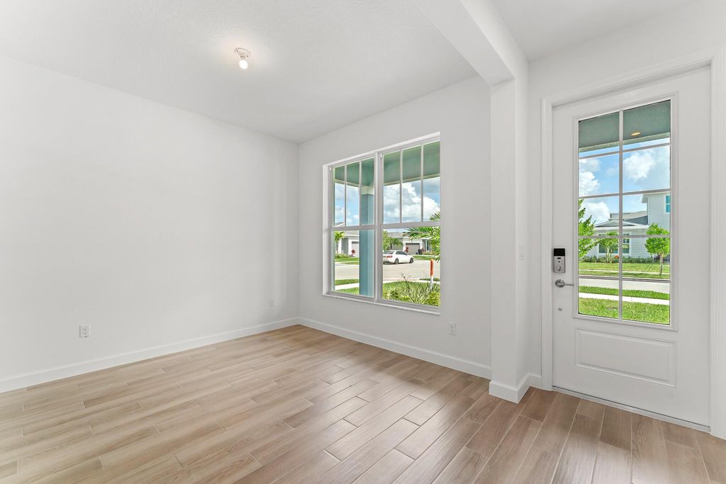 Photo of 9547 SW Indra Way, Port Saint Lucie, FL 34987 (MLS # R11109568)