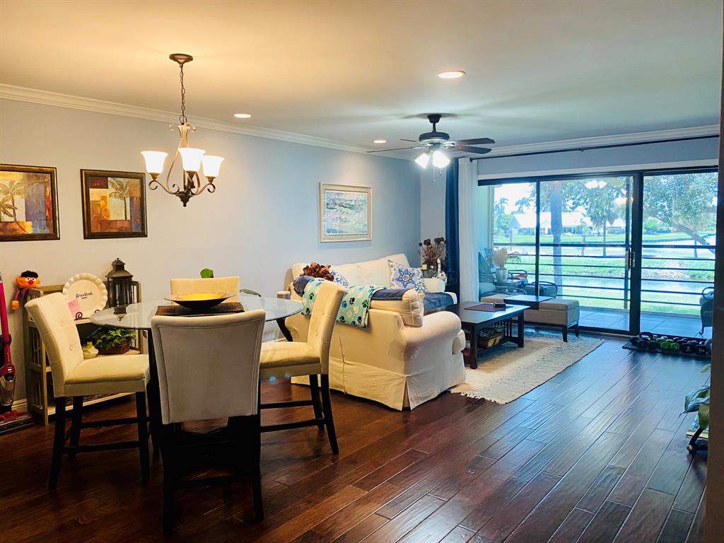 Spectacular spacious fully renovated, furnished condo with million dollar views! . Storage space is abundant with numerous closets throughout. 3rd bedroom currently set up as den; perfect for office space and/or workout area. Can be easily converted with addition of barn door to private 3rd bedroom. Enjoy gorgeous expansive double water & golf course views. End unit, private, windows galore, impact window in kitchen (for security), full accordion shutters. Community offers heated saltwater pool, clubhouse with kitchen & party room, tennis courts, exercise facility. One assigned parking spot conveniently located steps away from condo. Plentiful guest parking. Water/sewer/trash included in rent.