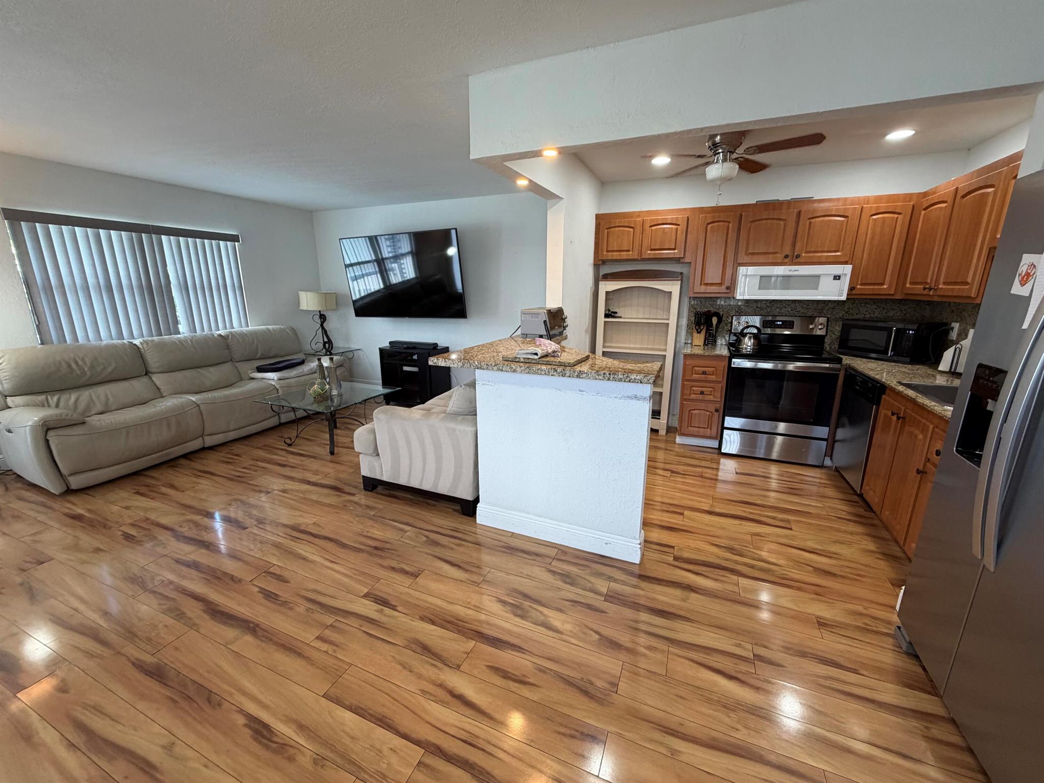 Discover this beautifully updated 1 bedroom, 1.5 bath condo on the 2nd floor of the desirable Kings Point golf community in Delray Beach. This unit is equipped with modern upgrades like a newer refrigerator, stove, kitchen faucet, and ceiling fan, with the bedroom AC recently updated.. The open kitchen features granite countertops and renovated bathrooms, all with stylish laminate flooring. Enjoy scenic golf course views from the living room.  A brand new lift has been installed.Kings Point is a vibrant 55+ community with amenities such as fitness centers, pools, tennis courts, and golf courses. Close to shopping, dining on West Atlantic Avenue, and attractions like Morikami Museum. Conveniently located near Boca Raton, West Palm Beach, and Palm Beach International Airport.