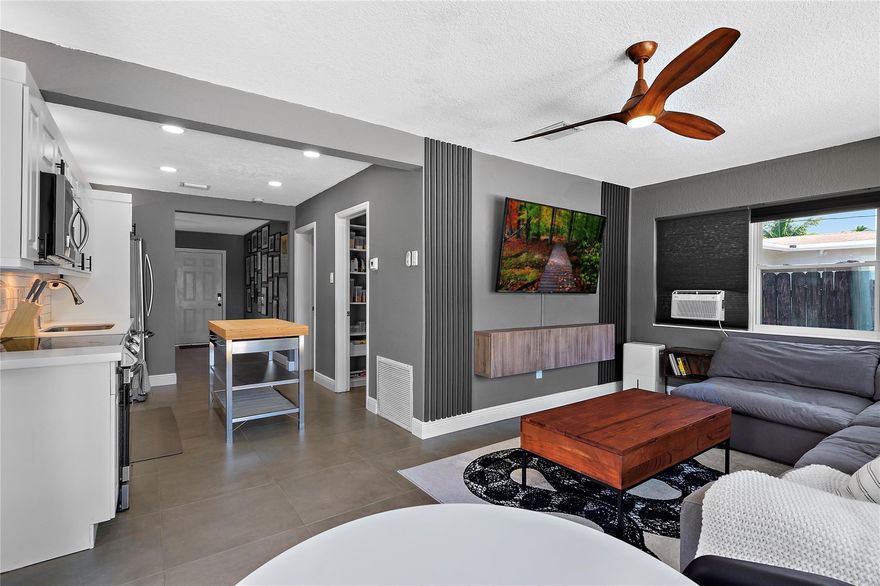 Stunning 3/2 fully REMODELED and FULLY FURNISHED home offers a perfect blend of style & comfort. Step in to find an open floor plan, high-end furniture, 65" TV'S & custom designer accents that create a warm & inviting atmosphere. NEW ROOF, A/C, WATER HEATER, LED LIGHTING, UPGRADED PLUMBING ensuring peace of mind for years to come (2020 OR NEWER). Kitchen is a chef's delight with new quartz countertops, cabinets, & s/s appliances. Pantry and Laundry room w/ custom built in cabinetry. Relax in the spacious living area or head outside to the lushly landscaped backyard with a sparkling pool – perfect for entertaining guests or enjoying some private downtime. Located near beaches, downtown, & highways, this property offers convenience without compromise. ZONED FOR AIR BNB - INVESTERS WELCOME!