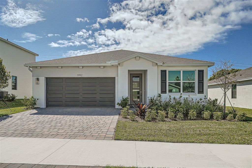 Photo of 1992 NE Ocean Dunes Drive, Jensen Beach, FL 34957 (MLS # R10988039)