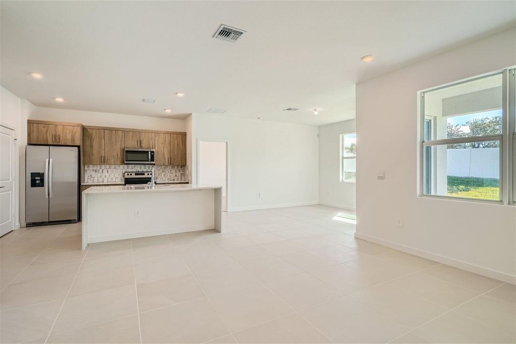 Photo of 1992 NE Ocean Dunes Drive, Jensen Beach, FL 34957 (MLS # R10988039)