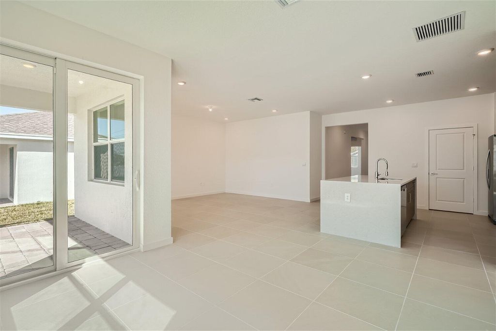 Photo of 1992 NE Ocean Dunes Drive, Jensen Beach, FL 34957 (MLS # R10988039)