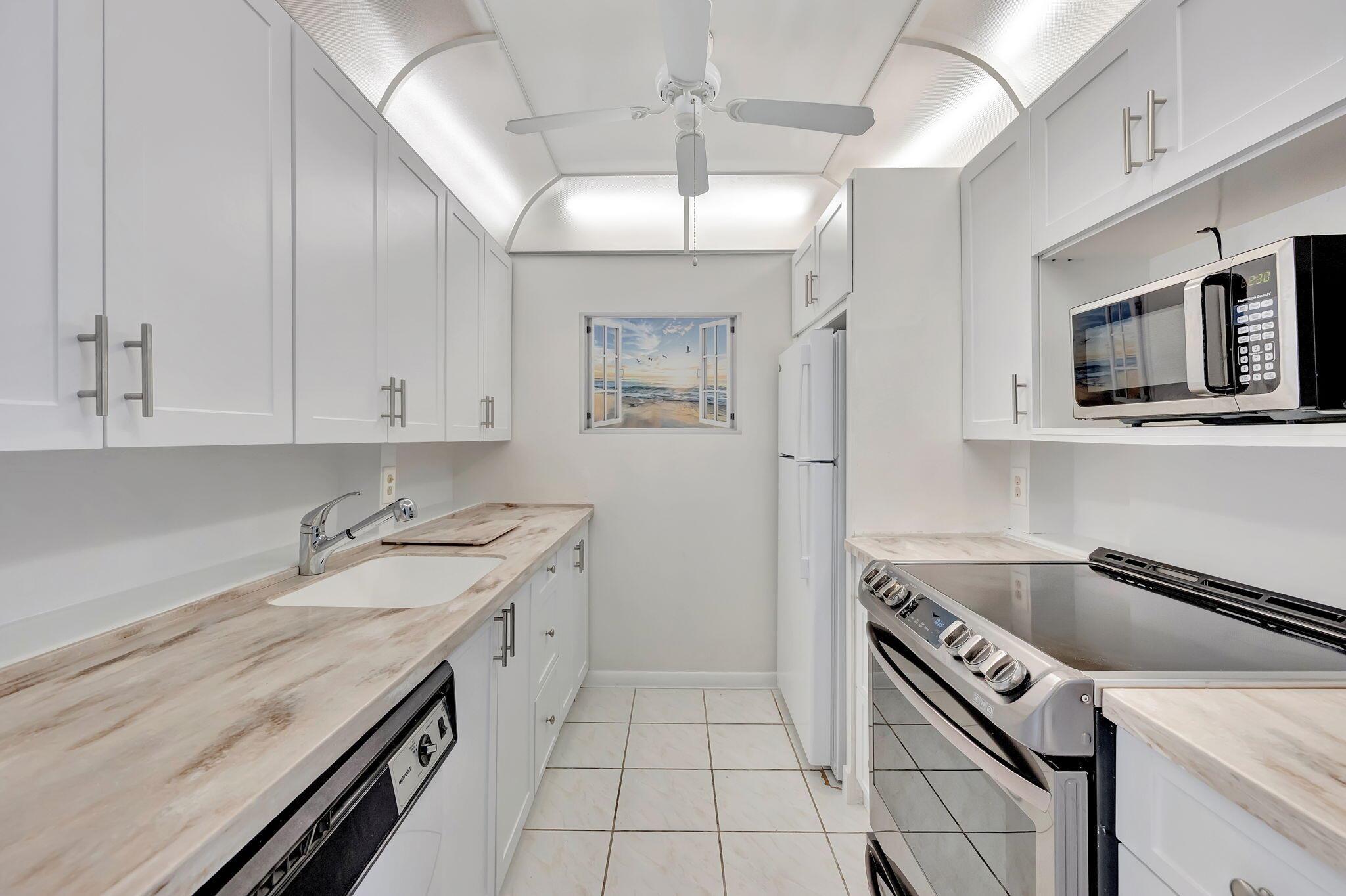NEW REDUCED PRICE!. Step into your new ground floor unit featuring a serene water view, brand new AC, and beautifully updated bathrooms and kitchen, all within a cozy 798 sq. ft. Enjoy the unbeatable location with the Martinique Village pool, BBQ area, and clubhouse all within walking distance.But that's not all! Dive into a host of amazing amenities, including a state-of-the-art Fitness Center, the charming Cafe on the Green, comprehensive Health Services, and an exclusive Country Club. Wynmoor has it all, and it's waiting for you!The ultimate active community designed just for you! Nestled just 6 miles from stunning beaches and conveniently located off the Florida Turnpike, this paradise offers everything you need.