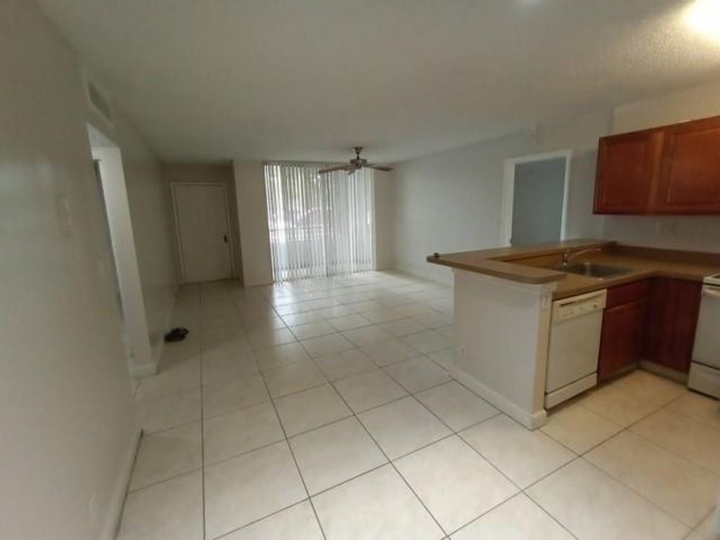 Photo of 941 Lyons Road #5-105, Coconut Creek, FL 33063 (MLS # F10546515)