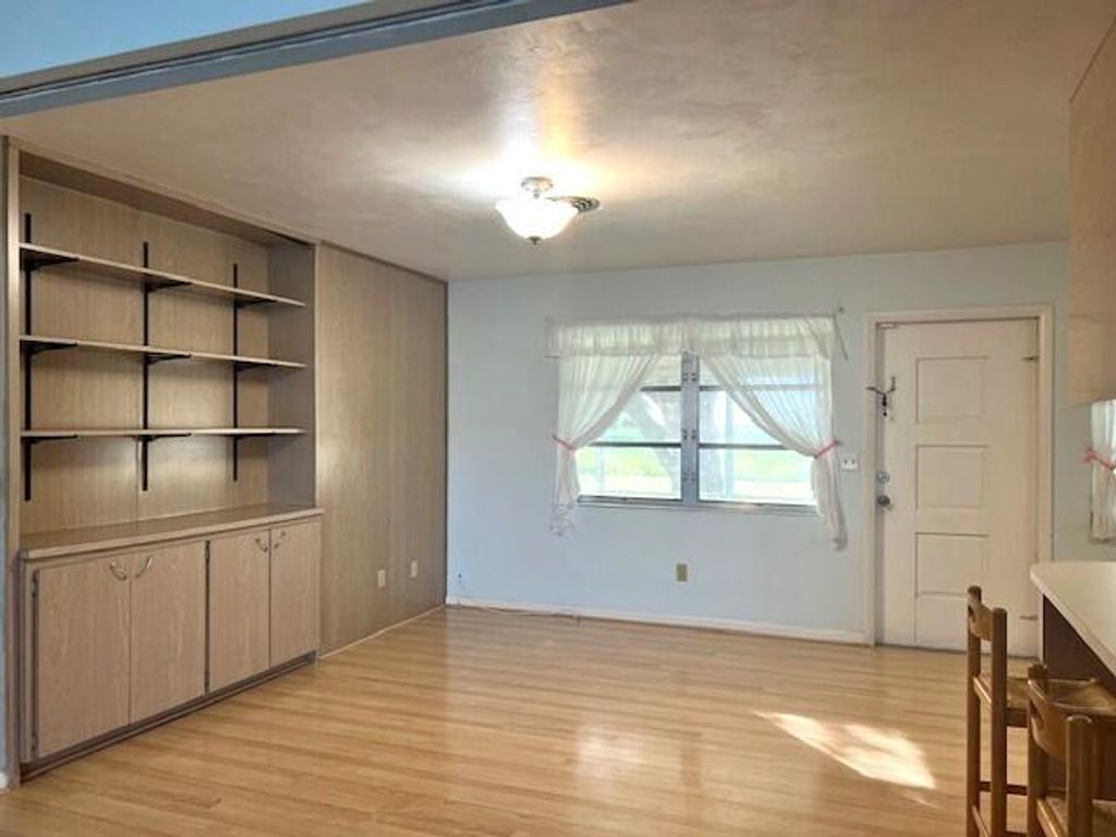 Photo of 100 Royal Palm Way, Belle Glade, FL 33430 (MLS # R11149008)