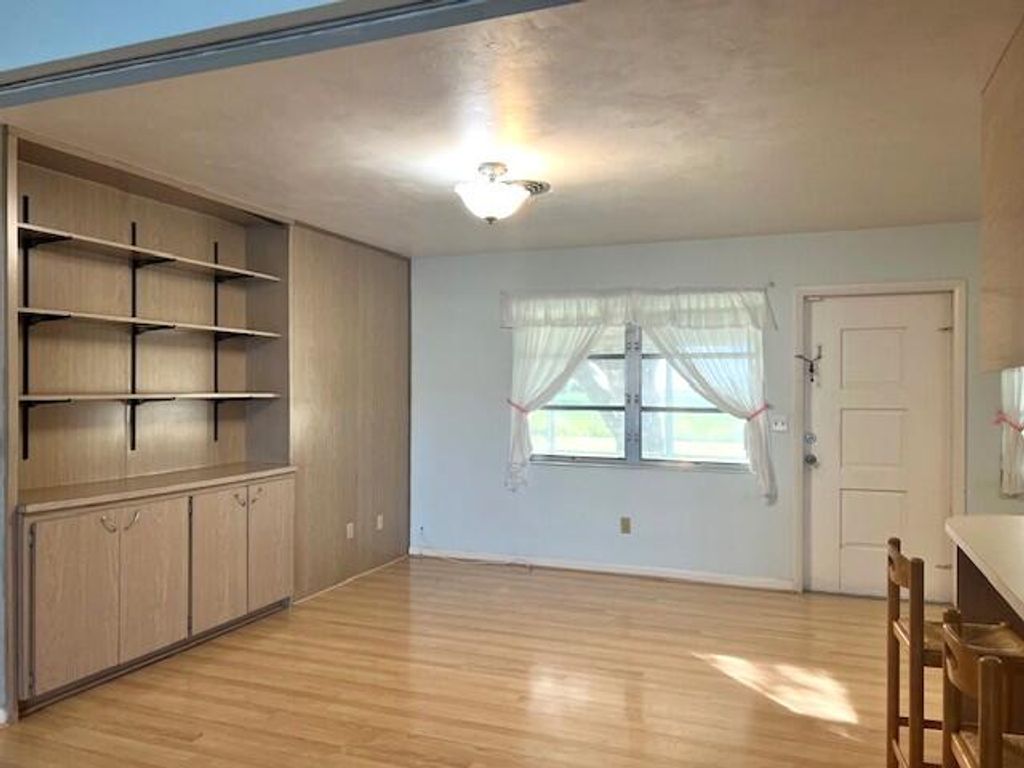 Photo of 100 Royal Palm Way, Belle Glade, FL 33430 (MLS # R11149008)