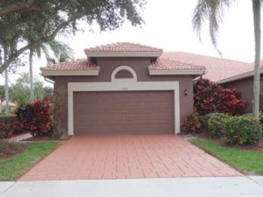 Immaculate meticulously upgraded 2BR+Den/2BA/2CG Villa with accordion hurricane shutters on premium large corner lot offering highly desired South exposure from yard! Superior 2012 totally upgraded kitchen w/full granite, wood cabinets, 2012 stainless steel appliances package, plus New 2014 A/C Lennox 16 Seer 3 Ton System. No carpet in this home. Bedrooms upgraded to laminate. Move In Ready & Absolutely Immaculate!