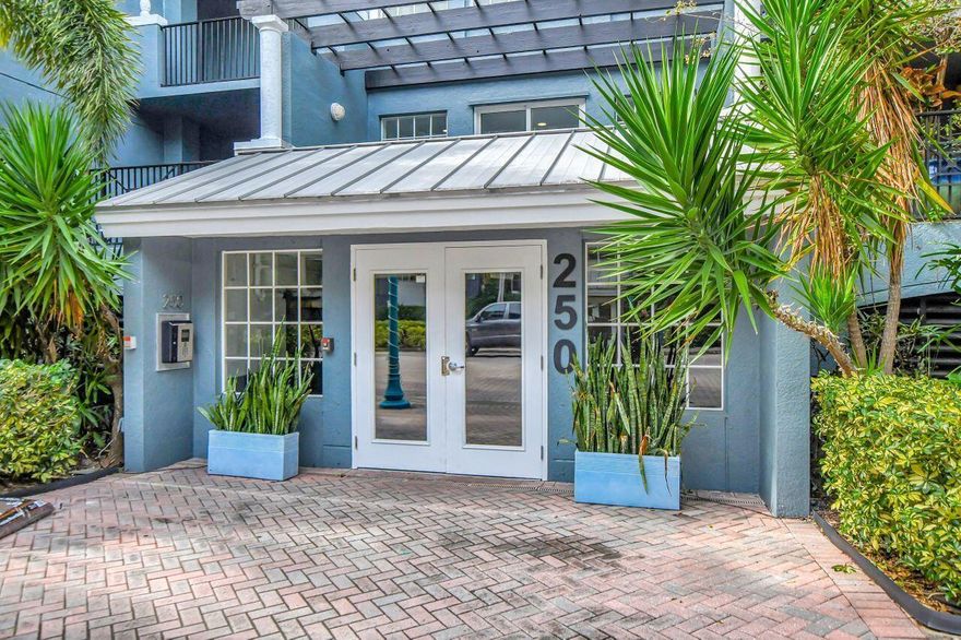 This Beautiful, move-in ready, 2 Bed/2 Bath condo is in the heart of Delray's Pineapple Grove Community with a view of treelined 3rd Ave, clubhouse and pool from its balcony. One assigned indoor parking space in the gated in-building garage is included with unit. This unit has been meticulously maintained and includes the following features: Granite Counter Tops, Stainless Steel Appliances, updated Kitchen and both Bathrooms with new Tile flooring, Hardware, Mirrors, Light Fixtures/Ceiling Fans, Sanitary Ware, Multi Pulsating Showerheads, and Electric GFCI Circuits throughout.  Hurricane Impact Sliding Glass Doors in the Living Room and Windows throughout, which is not standard for the PAG complex.   Located 2 blocks from North of Atlantic Ave. Walk to all the Shops and Restaurants. Can be Rented after 1st Year of Ownership. Min 6 months, twice a year thereafter. Proven Great Rental Potential! Access to the City of Delray Free Electric Cab Service, "FreeBee" for easy of Mobility to/from the Beach and Throughout all of Downtown. Key Features: 1. Installed GFCI electrical circuit breakers in the kitchen and both bathrooms 2. Updated Electric switches and electric points throughout, code compliant 3. Bathrooms: installed frameless sliding glass shower doors, new light fixtures, mirrors, faucets, medicine cabinets, quiet ceiling fans, and sanitary ware 4. Plastic Water Shutoff Valves Updated and Replaced with Metal water valves under kitchen sink, and both bathrooms 5. New garbage disposal under sink in kitchen 6. New goose neck high mount Kitchen Faucet 7. New Ceiling fan w/light fixture in Living room 8. New Ceiling light fixture in Dining Room 9. Hurricane Glass installed throughout this unit 10. New GE Washing Machine (3 years old).  Information contained herein is deemed reliable but subject to errors, omissions or changes without notice. All measurements are approximate. If not accurate, seller and listing office are not liable.
