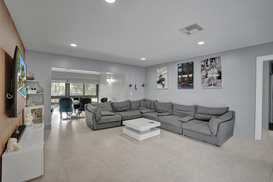 Stunning 3-bedroom, 2-bath unit with beautiful lake views from the moment you walk in. Remodeled kitchen features sleek white cabinetry, Bosch built-in oven and microwave, and elegant quartz countertops. Spa-inspired bathrooms boast fully tiled, European-style showers and walls. Glass-enclosed patio overlooks a tranquil lake with a fountain. Located in a 55+ community and equipped with hurricane impact windows.