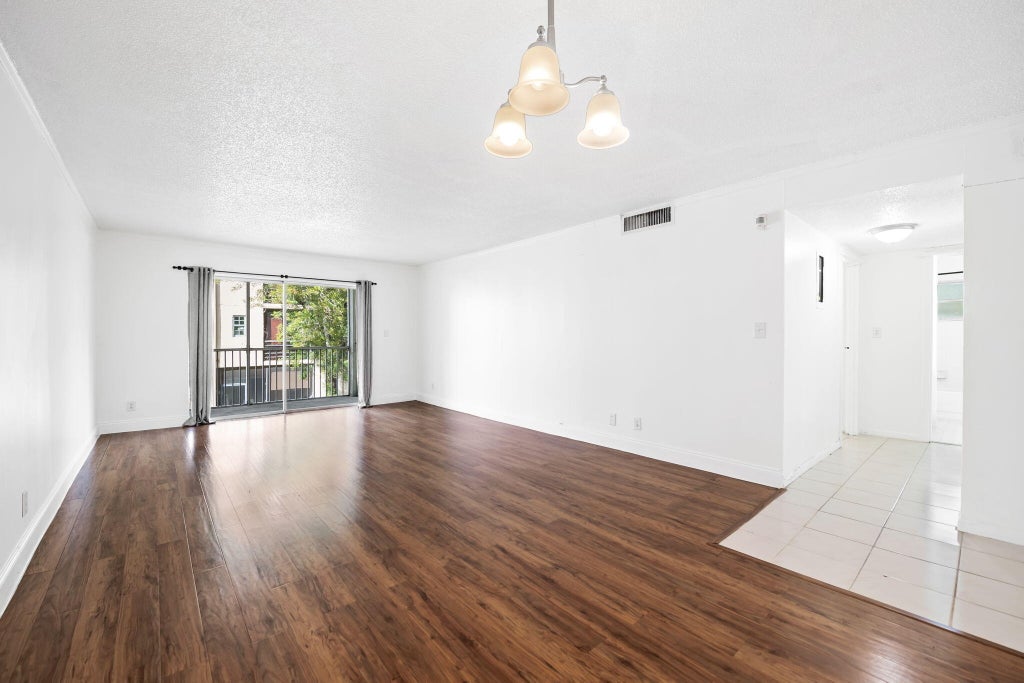 Photo of 3000 Riverside Drive #209-1, Coral Springs, FL 33065 (MLS # B26081278)