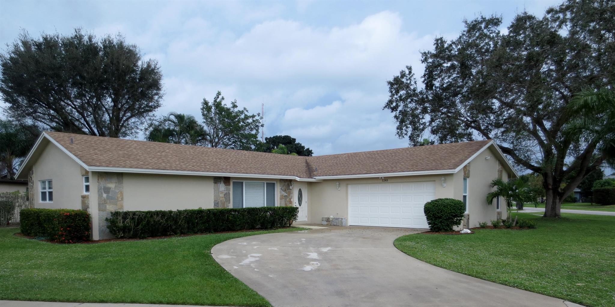 This charming corner-lot single-family home is located in the heart of Wellington, within a community known for its A-rated schools. Featuring a split floor plan with 3 bedrooms and 2 bathrooms, the home is bright, clean, and filled with natural light. It offers tile flooring throughout and a neutral color palette that complements any style. You'll appreciate the excellent curb appeal the moment you arrive. Additional highlights include impact windows throughout, a spacious kitchen with ample cabinetry and a stainless steel appliance package, and a laundry area equipped with a washer and dryer. A large screened-in porch provides the perfect space for enjoying outdoor living year-round.