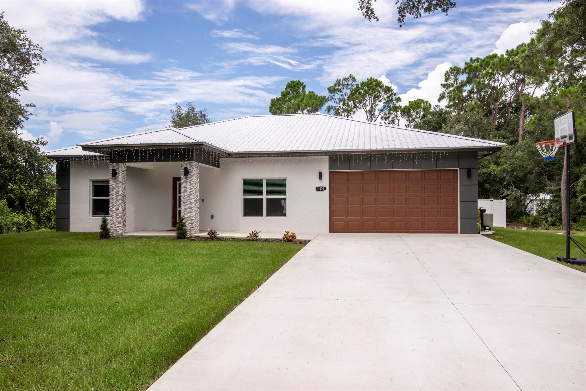 Welcome to this beautiful 2023 home in the prestigious gated community of Quail Acres located in Okeechobee. This one story 3BR 2BA features impact glass, a metal roof, 2-car garage, and a large backyard for entertaining. The eat-in kitchen features custom wood cabinetry, granite countertops, stainless steel appliances, and luxury vinyl flooring. The living and dining rooms are light and bright with an open floor plan that features luxury vinyl flooring, fresh paint, and a huge backyard to enjoy with your family and friends. The primary bedroom is a generous size with luxury vinyl flooring, freshly painted and a large walk-in closet with ample storage. The bathrooms are both gorgeous with custom cabinetry, granite counters, and pretty tile flooring. Quail Acres is a very