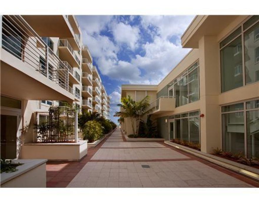 Best of both worlds. Townhouse unit in a condo building!  Both bedrooms with walk-in closets and balconies, two full bathrooms, and laundry are upstairs. Midblock offers an attended front desk, secured garage, pool, barbeque area and gym.