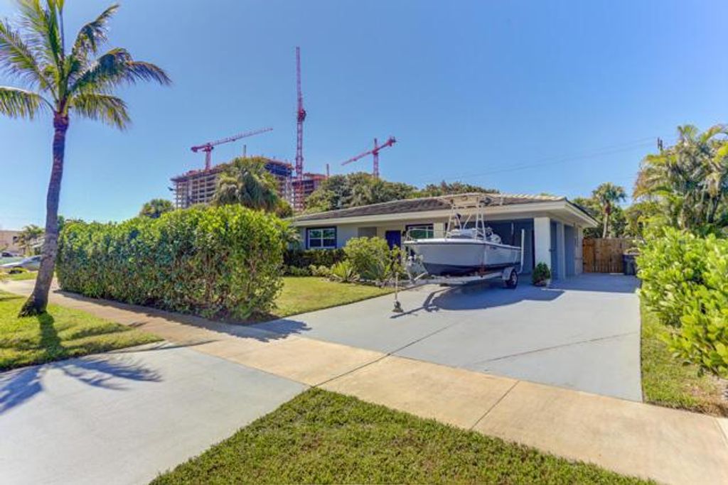 Photo of 140 Date Palm Drive, Lake Park, FL 33403 (MLS # R11062873)