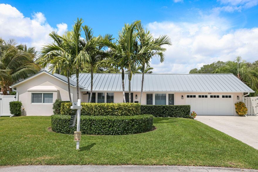 Welcome to one of Lighthouse Point's most versatile pool homes. This 4-bed, 3-bath CBS residence features a rare triple-split floor plan — ideal for multi-generational living, a home office, or guest suite — all on one level. The heated saltwater pool and fenced backyard create a private outdoor retreat, while a 2-car garage with epoxy floors adds everyday convenience. Major updates are already done: brand-new 2023 metal roof, complete impact glass throughout, and 2022 AC. No HOA, no restrictions. Minutes to marinas, dining, and the beach. A true South Florida lifestyle home priced to move. This thoughtfully laid-out home gives buyers something increasingly rare in Lighthouse Point: space, flexibility, and major capital improvements already completed. The triple-split floor plan separates the primary suite from secondary bedrooms, offering true privacy for owners while accommodating guests, a home office, or a gym without sacrificing bedroom count. The heated saltwater pool anchors a fully fenced backyard with an open patio and covered patio portion — perfect for year-round entertaining. Inside, the kitchen and family room flow seamlessly for everyday living. The oversized 2-car garage features epoxy floors, laundry, and pull-down attic storage. Additional highlights include a built in wine cooler and bar, walk-in closets, plantation shutters, and custom lighting throughout. For the practical buyer: the 2023 metal roof, complete impact glass, and CBS construction provide exceptional insurance value and true peace of mind. Located on a quiet street in the heart of Lighthouse Point — no HOA, close to Dan Witt Park, top-rated schools, waterfront dining, and Lighthouse Point Marina.