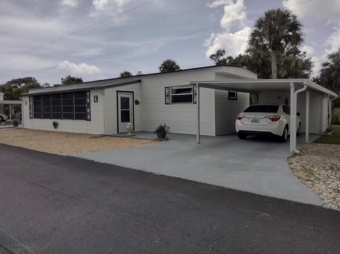 Welcome to your Florida retreat in the vibrant 55+ community of Lake Manor, ideally located near the scenic Indian River Drive! This beautifully updated 1 bedroom, 1 bathroom manufactured home offers comfort, functionality, and peace of mind with modern upgrades throughout.Step inside to find a spacious master bedroom with a walk-in closet and ensuite bathroom, perfect for relaxed, everyday living. The home features water-resistant Pergo laminate flooring, partial hurricane impact windows enhanced with Llumar hurricane impact and debris film, and a host of major upgrades completed within the last 10 years -- including new wiring, plumbing, drywall, siding, mold and mildew resistant insulation, metal roof, and windows.Enjoy the Florida lifestyle from your enclosed Florida room