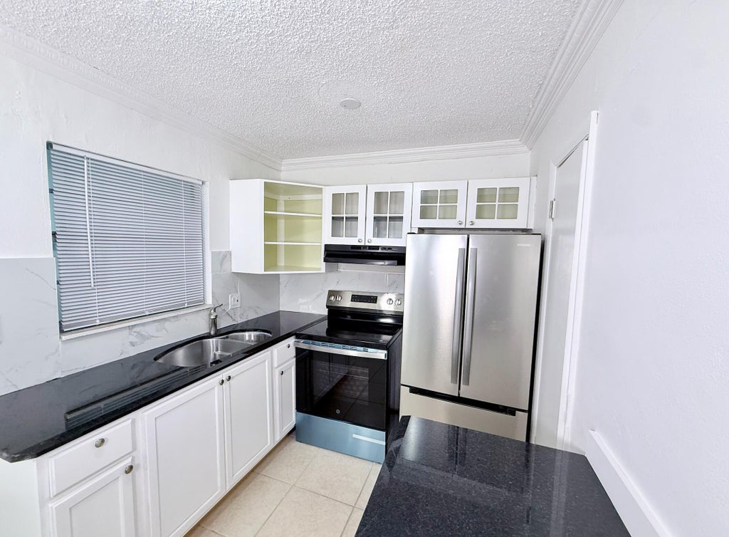 Photo of 1280 NW 43rd Terrace #107, Lauderhill, FL 33313 (MLS # B26085789)
