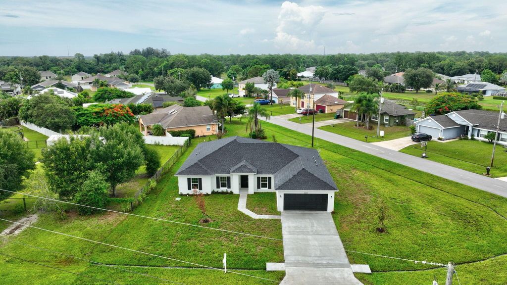 Photo of 6205 NW Sayers Avenue, Port Saint Lucie, FL 34983 (MLS # R10987860)