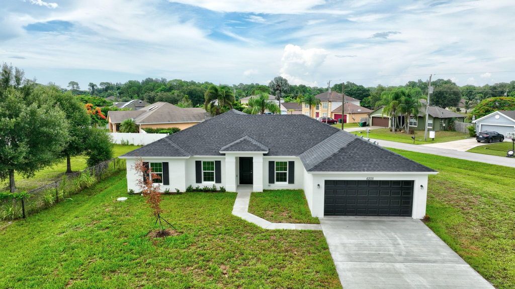 Photo of 6205 NW Sayers Avenue, Port Saint Lucie, FL 34983 (MLS # R10987860)