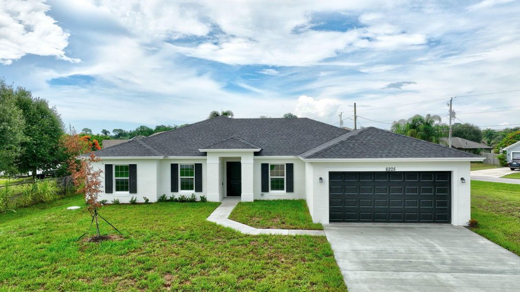 Photo of 6205 NW Sayers Avenue, Port Saint Lucie, FL 34983 (MLS # R10987860)