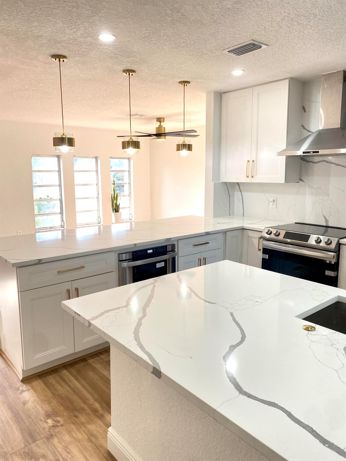 Looking for a spacious POOL home on nearly a HALF-ACRE oversized lot? This beautifully upgraded property is a rare find and the only one of its kind in a NO HOA neighborhood! The open SPLIT floor plan has luxurious finishes throughout, including a modern kitchen with new Samsung appliances, breakfast nook, and ample space. The primary suite features a large walk-in closet, double vanity, rain shower, bench, niche, and a spa soaking TUB. Guest bedrooms are generously sized, while the guest baths offer double vanities and designer finishes-one with direct pool access. Additional features include a dedicated laundry room with new washer/dryer, a TILED fireplace, and a versatile multipurpose room for office, den, or extra bedroom. 2025 pool resurfacing & pool pump & driveway resealed.