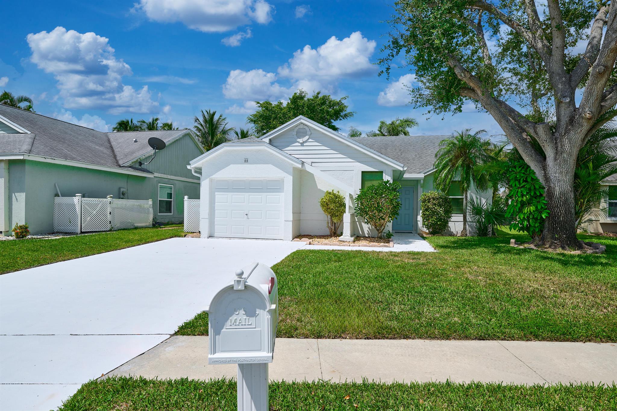 This bright and open home boasts cathedral ceilings providing lots of natural light throughout. The kitchen has been lovingly updated with gray shaker cabinets, sparkling quartz countertops and steel appliances. A bonus room has been added (off the kitchen )and is being used as a 4th bedroom.Floors flowing throughout the home are luxury vinyl plank surrounded by freshly painted interior walls. The exterior and driveway have also been recently painted.In addition, both bathrooms have been updated with new vanities, light fixtures and tile in the shower areas. If that's not all, this home has a new roof built in 2019 and complete Impact windows and doors. Enjoy peaceful mornings and beautiful sunset views on your open patio over looking the lake! Welcome Home!