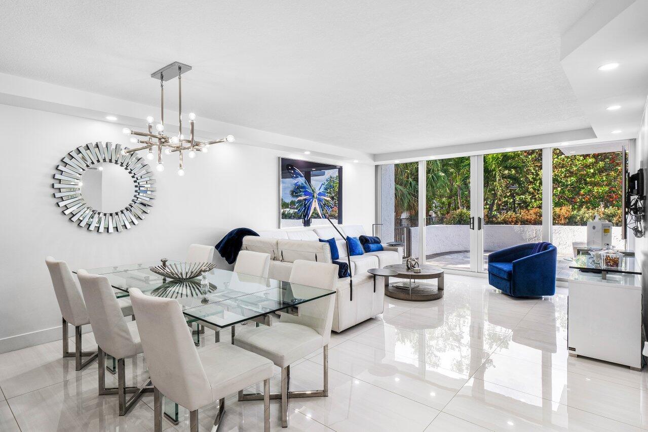 Experience the epitome of coastal luxury in this beautifully renovated condo, where indoor elegance meets expansive outdoor living. This residence features a fully updated interior and an oversized private terrace that nearly doubles your living space--ideal for sophisticated entertaining or serene relaxation in a setting that feels more like a private home than a condominium. Inside, the open-concept living room and both bedrooms flow seamlessly onto the sprawling terrace, creating a true indoor-outdoor lifestyle. The designer kitchen is both functional and beautiful, featuring quartz countertops, abundant cabinetry, statement backsplashes, and high-end Wolf appliances. The spa-inspired primary bathroom has been completely reimagined with a glass-enclosed shower, & a private water closet.