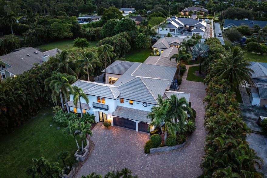 Simply a Stunning Estate Home. A breathtaking 6 bedroom Main House, a beautiful 3 bedroom/2.5 bath Guest House & a 1 bedroom/1 bath Pool House created a very special home! Walls of impact glass thruout all houses allow for views of the manicured grounds & pool area. The main house offers large open living areas, soaring ceilings, a new crisp white kitchen with top shelf appliances, quartz countertops & impeccable finishes. The primary suite is impressive in size with a sitting area, large closets, & a spa-like bathroom. Gorgeous renovations, a movie theater, loft, gym, glorious outdoor spaces, a pool, courtyards, breezeways add to the splendor of this luxurious resort style family sanctuary. This remarkable estate is perfect for Multi Generational households and is a rare opportunity.