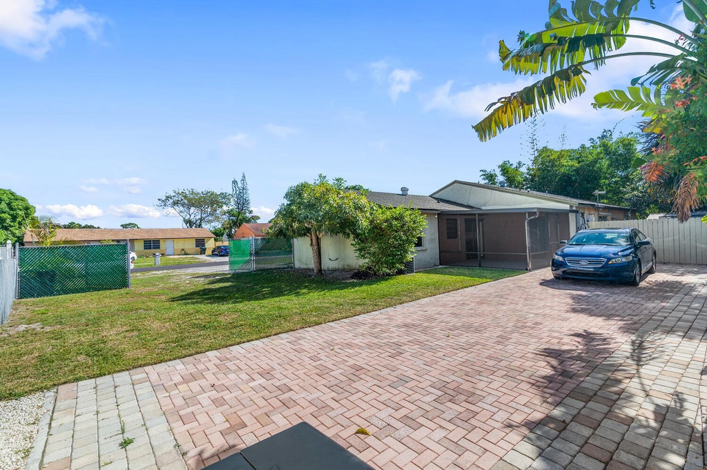 Photo of 4619 Gladiator Circle, Greenacres, FL 33463 (MLS # B26032902)