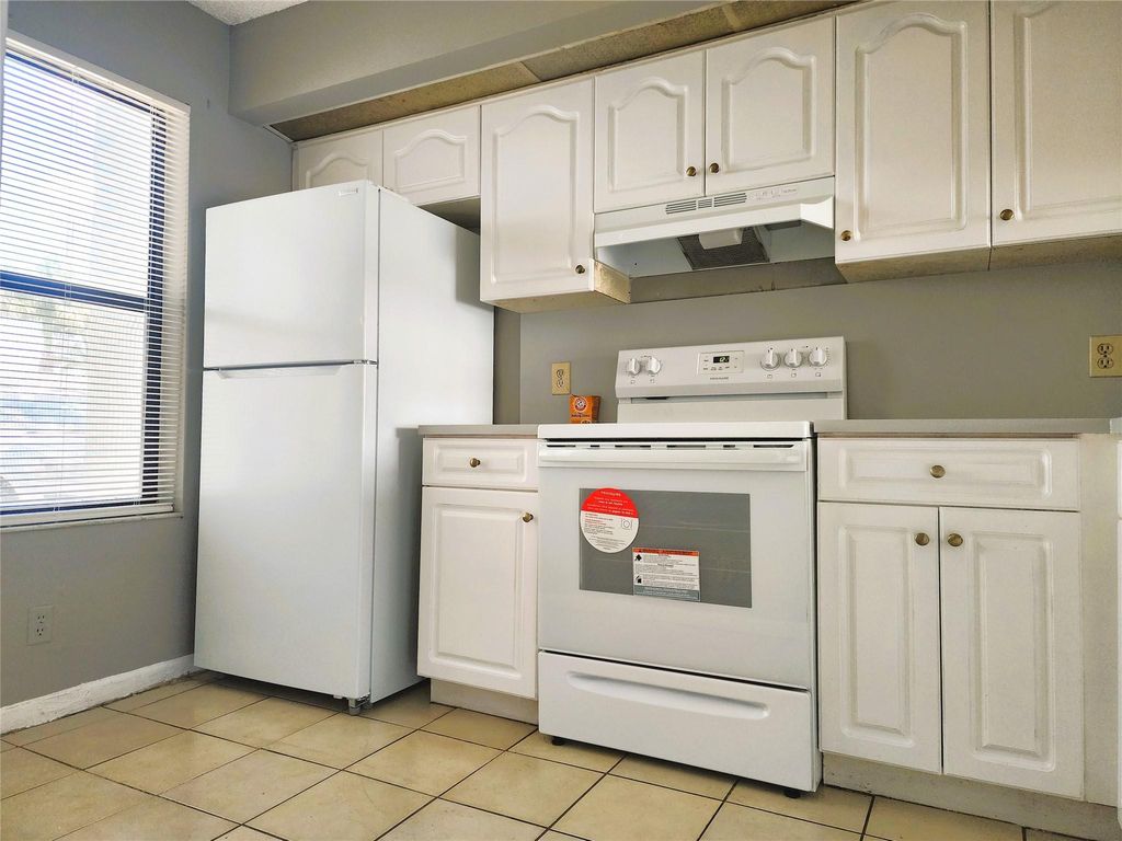 Photo of 217 Lake Pointe Dr #107, Oakland Park, FL 33309 (MLS # F10516129)