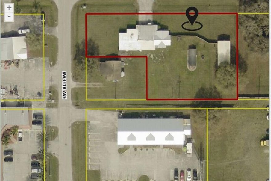 Developing area less than a mile to downtown Okeechobee area, just over 4 miles to Lake Okeechobee. Lot is flat, no trees. There is a 3+/2 bedroom home w/carport on this .65 acre property and two other structures too. Either keep or knock down existing home/bldgs. Great for an investor/developer to build multiple properties on this corner lot or if you're a private owner who wants to build for multigenerational this could be the one for you. An additional lot may be able to be negotiated as well if price is right so you'd own the complete acre corner lot. Currently zoned residential but surrounded by commercial properties, you have the option of rezoning it to commercial or multifamily, call Okeechobee County for more details.