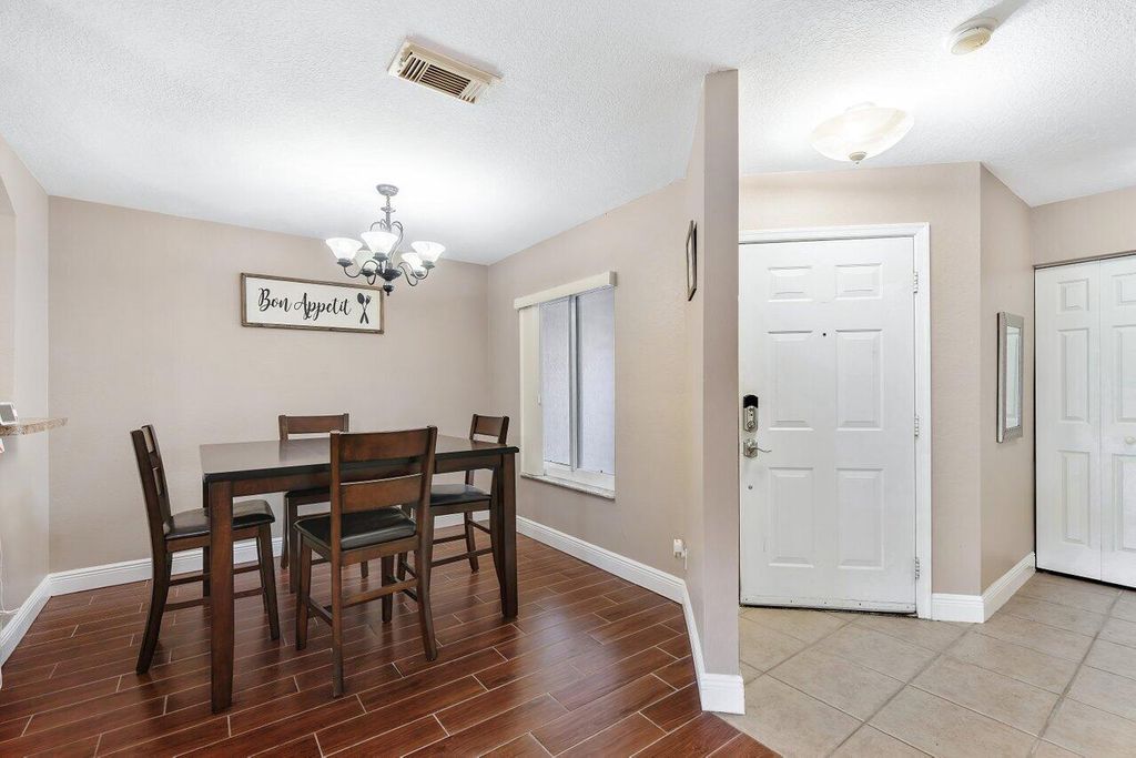 Photo of 5206 Crossing Rocks Court, Riviera Beach, FL 33407 (MLS # R10959623)