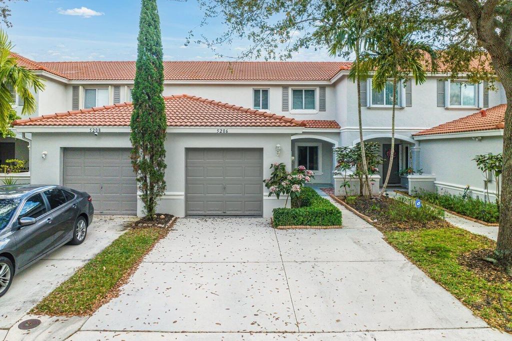 Photo of 5206 Crossing Rocks Court, Riviera Beach, FL 33407 (MLS # R10959623)