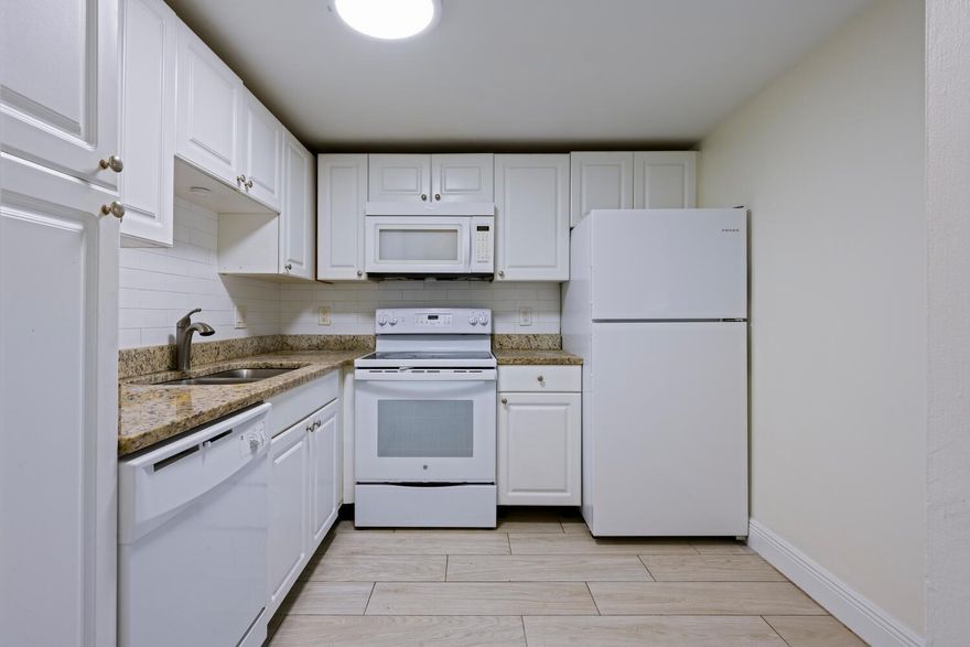 Welcome to a freshly updated 2-bedroom, 1.5-bath rental in the heart of Lake Park. This bright and clean unit features updated kitchen with granite countertops, undermount stainless steel sink and full subway tile back splash, Upgraded bathrooms, custom plank style porcelain tile imported from Spain throughout the entire unit & spacious balcony area, crown molding, and a west-facing balcony perfect for evening breezes. Enjoy a spacious layout with on-site laundry, assigned parking space with additional off-street parking, and access to the community pool. Conveniently located near I-95, Publix, Costco, and just minutes from the beach and Intracoastal. Well-maintained and move-in ready--schedule your tour today!