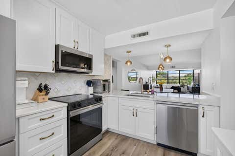 Photo of 3635 Whitehall Drive #302, West Palm Beach, FL 33401 (MLS # B26064733)