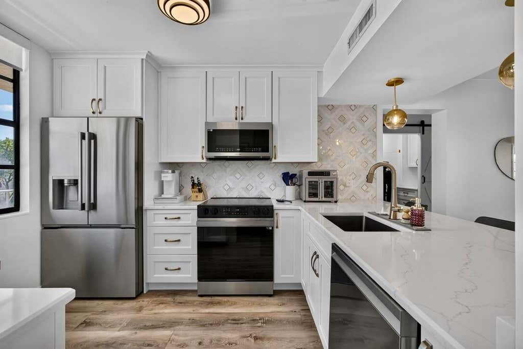 Photo of 3635 Whitehall Drive #302, West Palm Beach, FL 33401 (MLS # B26064733)