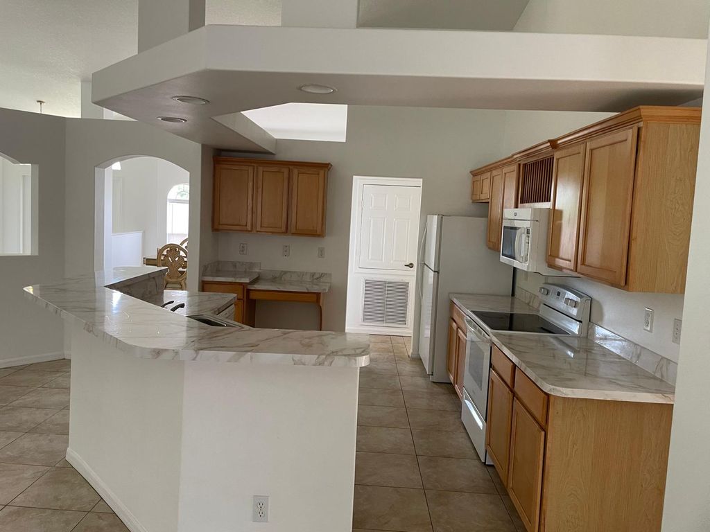 Photo of 601 SW Grove Avenue, Port Saint Lucie, FL 34983 (MLS # R11108337)