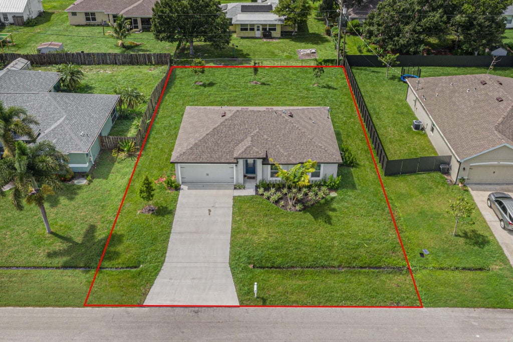 Photo of 1926 SW Beard Street, Port Saint Lucie, FL 34953 (MLS # R11052108)