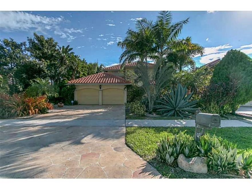 WATERFRONT Club Med Style paradise 2 story designer home and gardens with massive royal palms, bamboo garden, lily pond. waterfront deck and largest screened patio with water mister and 24 jet medical spa. White sugar sand trail and incredible imported It alian granite, SS appliances, GE Duet washer/dryer in-house ,hurricane windows-shutters, hand crafted simulated bolder driveway, and $4,200 glass etched front doors.