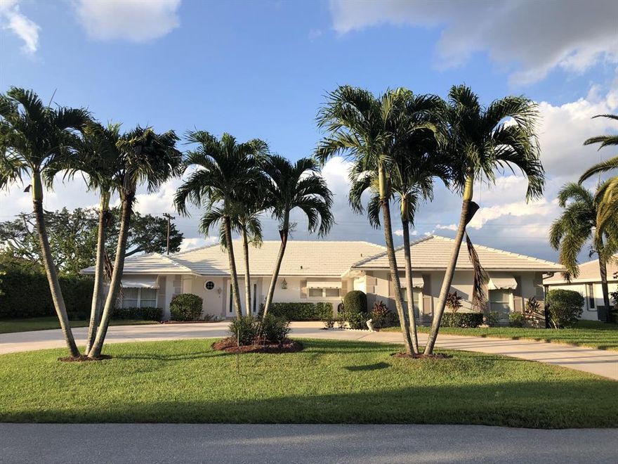 Lovely 3 bedroom/3 bath golf course home in the coveted City of Atlantis. Enjoy spectacular, panoramic golf course views from a spacious screened in patio area with heated swimming pool and endless opportunities for entertainment. Highly desirable split floorpan with renovated kitchen and a large master suite including walk-in closets and dual sinks. Situated on a substantial 14,000+ square foot lot on the 3rd hole of the Atlantis Country Club with great backyard space. Includes an oversized 2-car garage, additional golf-cart garage and circular driveway, all with incredible curb appeal. The City of Atlantis is a private gated community offering two outstanding golf clubs, tennis courts, Kintz Park, and it's own City Council and Police Department. Located adjacent to JFK Hospital, and minutes away from downtown West Palm Beach, Lake Worth, the beach and PBI Airport.