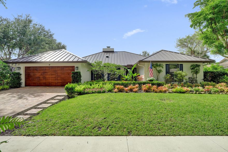 Welcome to Millpond — one of Boca Raton's most picturesque and sought-after communities, where majestic tree-lined streets, lush tropical landscaping, scenic lakes, and winding sidewalks create a setting that feels straight out of a postcard. Nestled within this storybook neighborhood is a beautifully renovated 4-bedroom, 2.5-bath residence offering 2,384 square feet of luxurious living space with timeless design and high-end upgrades throughout. A full 2025 renovation transformed the kitchen, baths, flooring, closets, and lighting, creating a completely move-in-ready home that blends elegance with everyday comfort. The designer kitchen features premium Viking stainless steel appliances, including a gas cooktop and oven, refrigerator/freezer, range hood, and Bosch dishwasher, as well as custom cabinetry and French country-inspired finishes. Vaulted ceilings, luxury vinyl flooring, plantation shutters, built-in closet systems, updated LED lighting, and a cozy fireplace create warmth and sophistication throughout the home. Major upgrades provide true peace of mind, including a 2022 metal roof, complete impact windows and doors, two 2022 Trane AC units, a whole-house gas generator, a tankless water heater, and a new electric panel. Step outside into your own resort-style backyard oasis featuring a resurfaced Pebble Tec pool, raised wood sun deck, tranquil pond waterfall, lush tropical landscaping, landscape lighting, Sonos outdoor speaker system, and an expansive patio with remote-controlled motorized screens. The outdoor kitchen is designed for entertaining, featuring an Alfresco gas grill, a vent hood, granite countertops, and custom cabinetry. Additional highlights include a renovated garage with epoxy floors and custom storage, pull-down attic access, paver driveway and patios, B-Hyve sprinkler system, perimeter security lighting, and exceptional privacy throughout the property.  Millpond offers a lifestyle unlike any other with low HOA fees, scenic lakes, tennis and basketball courts, playgrounds, picnic areas, and beloved community events throughout the year. The community is known for its strong sense of connection, offering a lifestyle centered, fun, and togetherness. Residents enjoy a variety of events throughout the year, including food truck nights, holiday celebrations, seasonal gatherings, and cherished traditions that make every season feel special. Zoned for A-rated schools, including Blue Lake Elementary, and conveniently located near Town Center at Boca Raton, Mizner Park, pristine beaches, parks, dining, and major highways. A rare opportunity to own a truly special home in one of Boca Raton's most charming and magical neighborhoods.