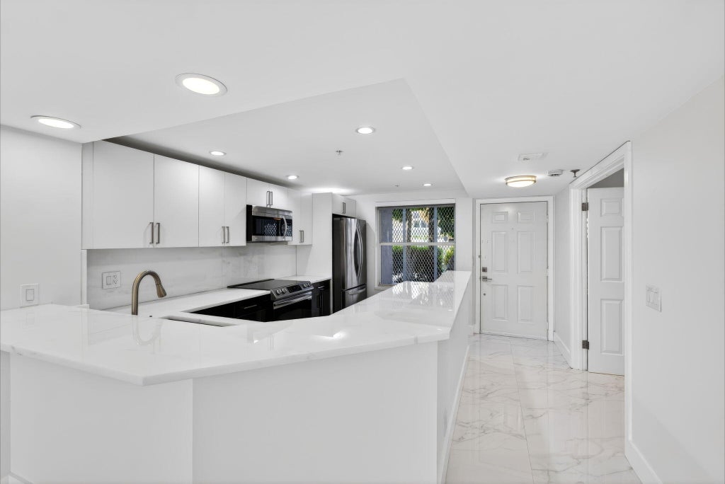 Photo of 3901 S Flagler Drive #105, West Palm Beach, FL 33405 (MLS # B26032675)