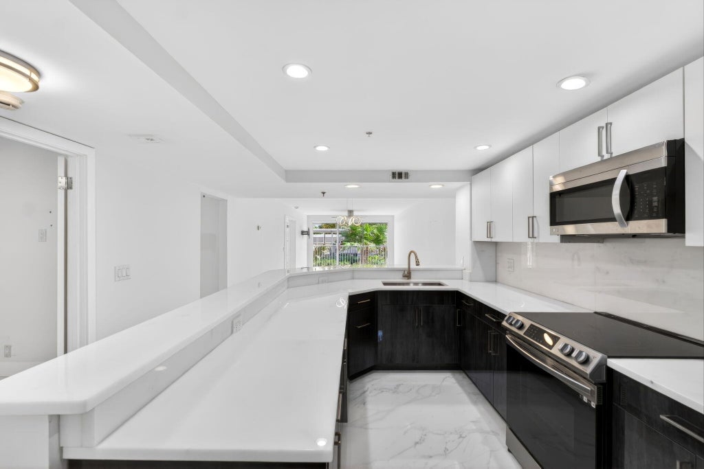 Photo of 3901 S Flagler Drive #105, West Palm Beach, FL 33405 (MLS # B26032675)
