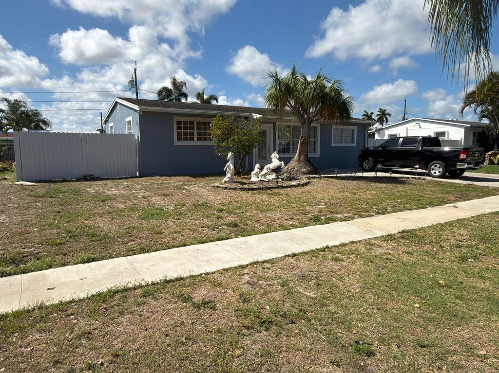 Photo of 129 Cayman Dr, Palm Springs, FL 33461 (MLS # B26000678)