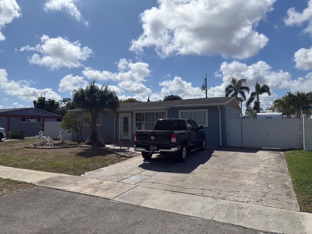 Photo of 129 Cayman Dr, Palm Springs, FL 33461 (MLS # B26000678)