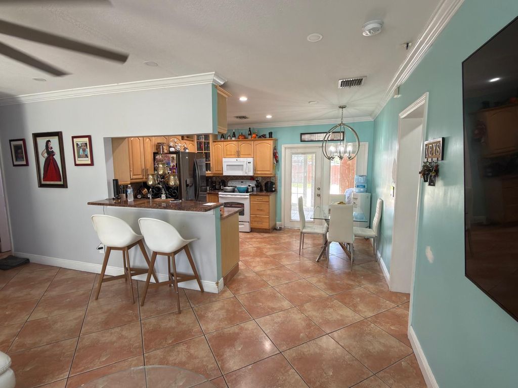 Photo of 129 Cayman Dr, Palm Springs, FL 33461 (MLS # B26000678)